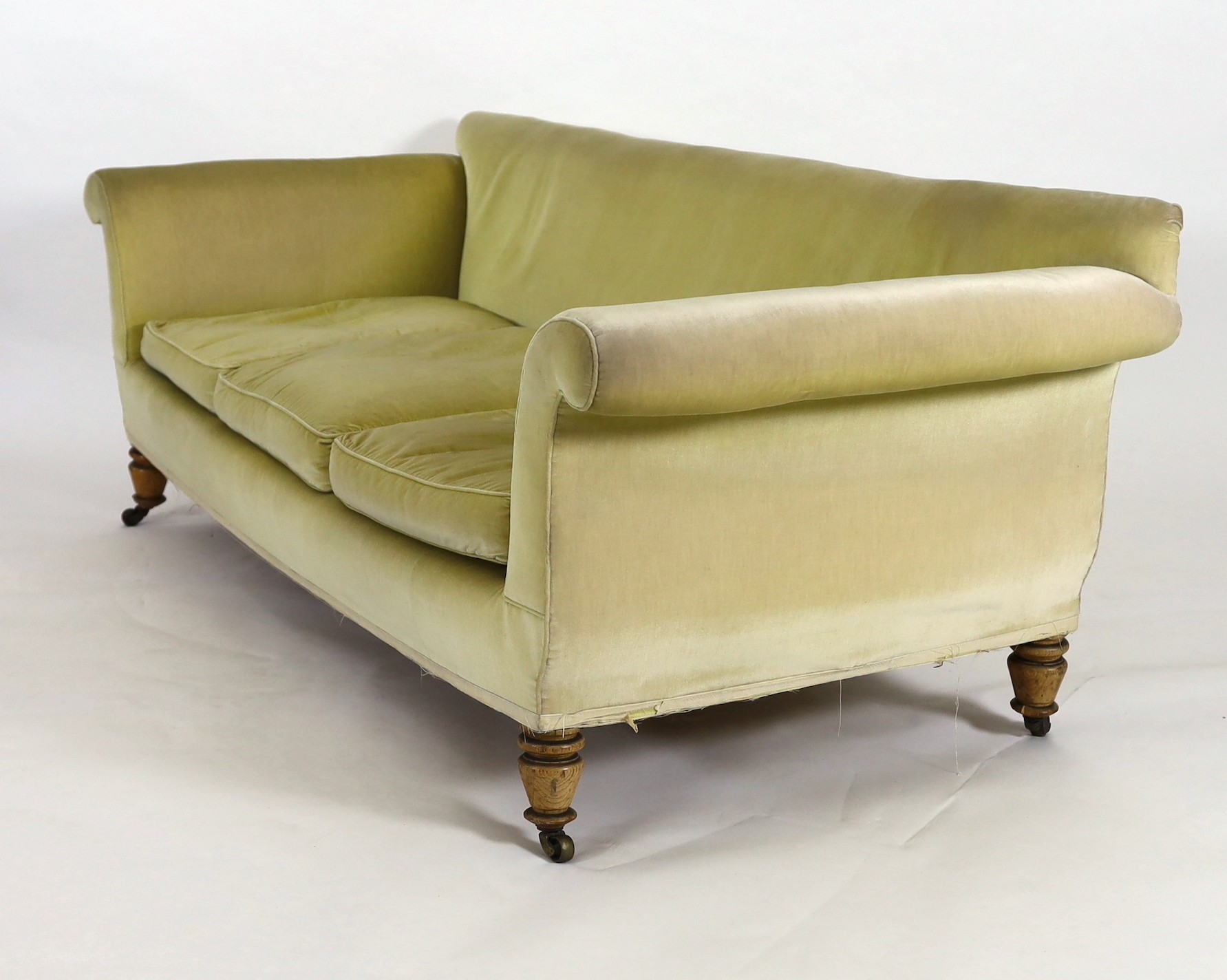 A Victorian Howard & Sons oak settee, W.236cm D.92cm H.80cm